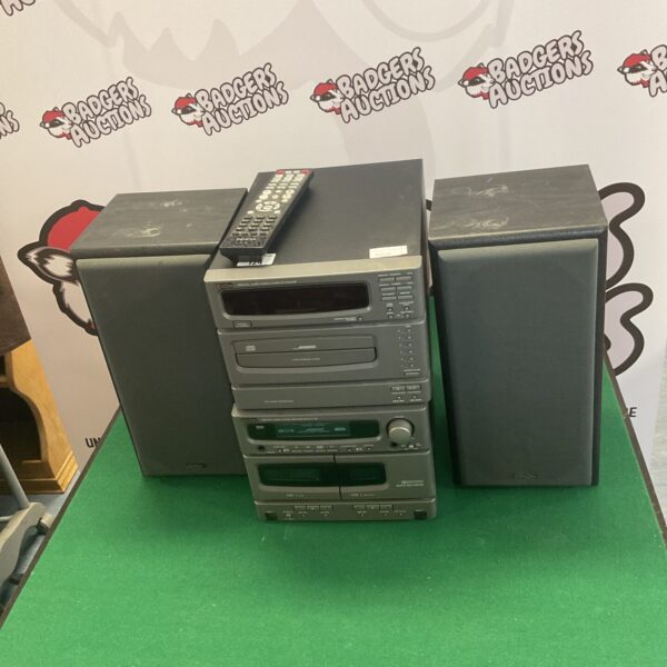 Black Denon audio system with amplifier and tuner deck.