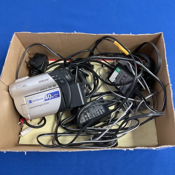 Sony DCR-DVD106 Handycam camcorder with cables and accessories.