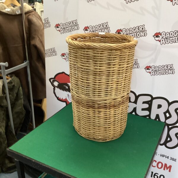 Woven rafia laundry basket for storage and home decor.