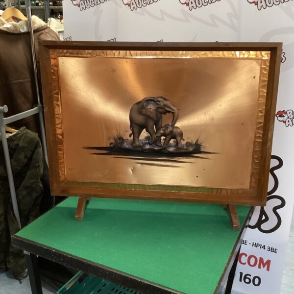Vintage copper relief depicting an elephant, detailed embossed artwork.