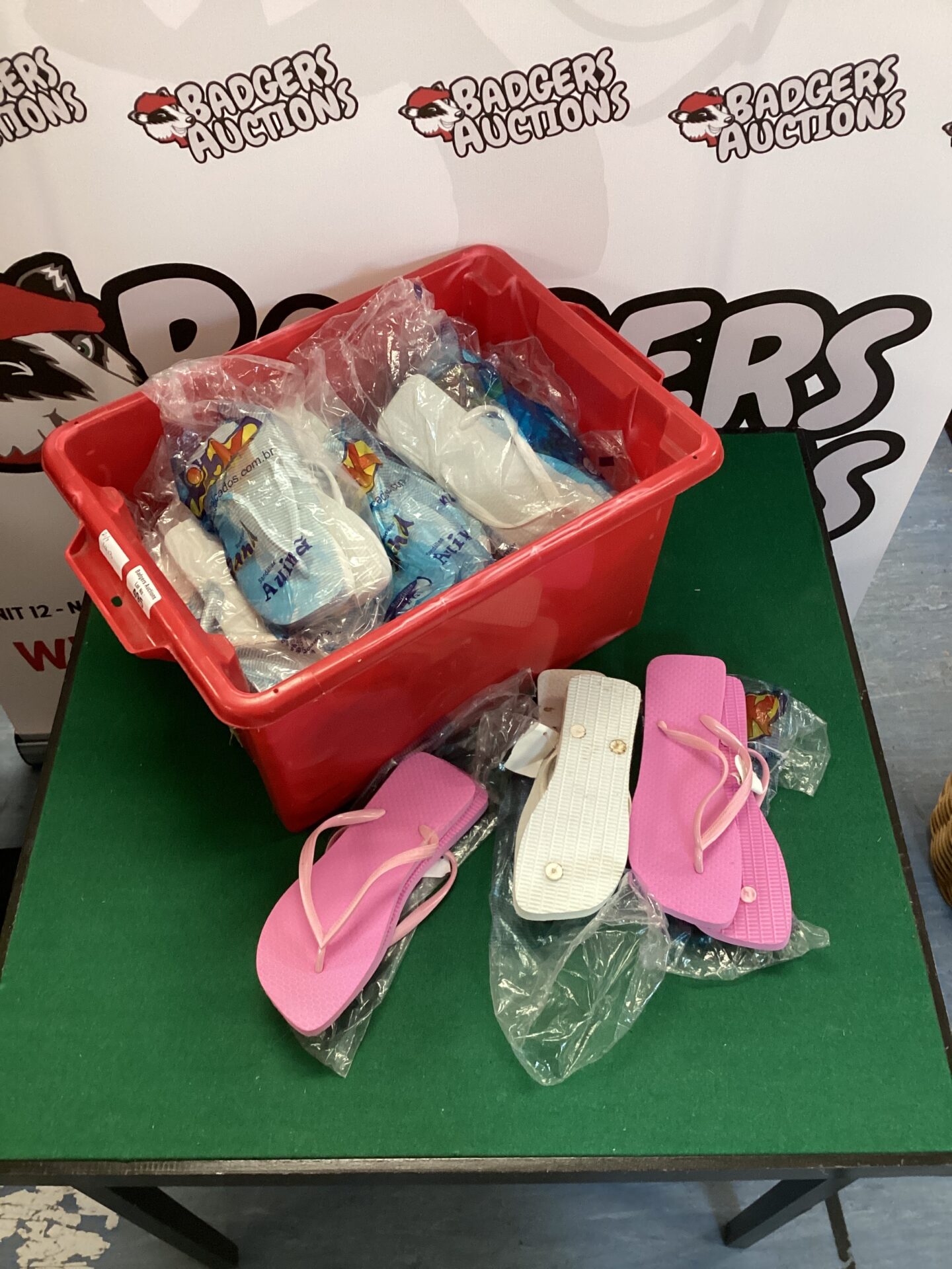 495 Red tub of flip flops