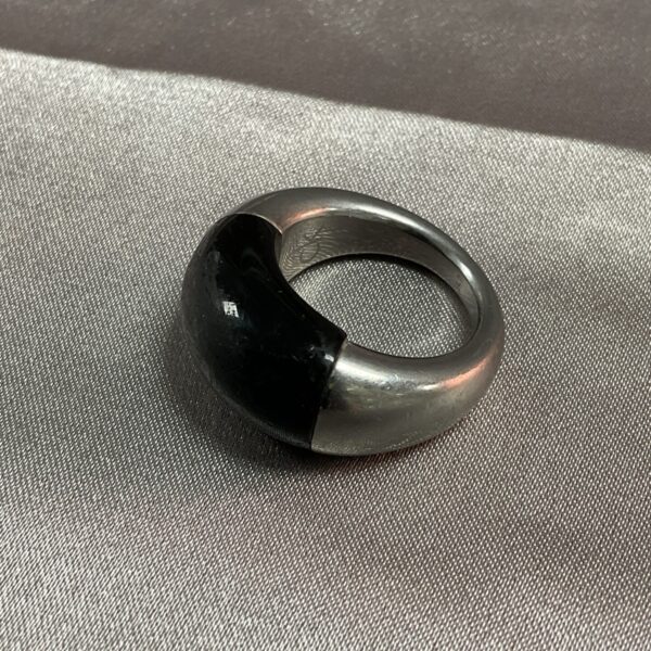 Calvin Klein ring with black stone and whitemetal band.