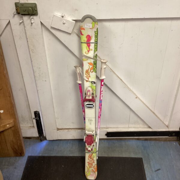 Colourful Rossignol junior girl ski set with poles.