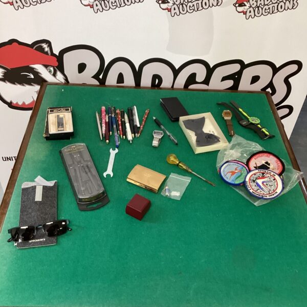 Mixed lot of vintage collectibles in a decorative tin.