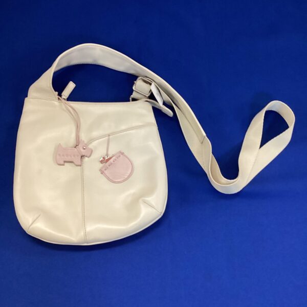 White leather Radley handbag with dog emblem.