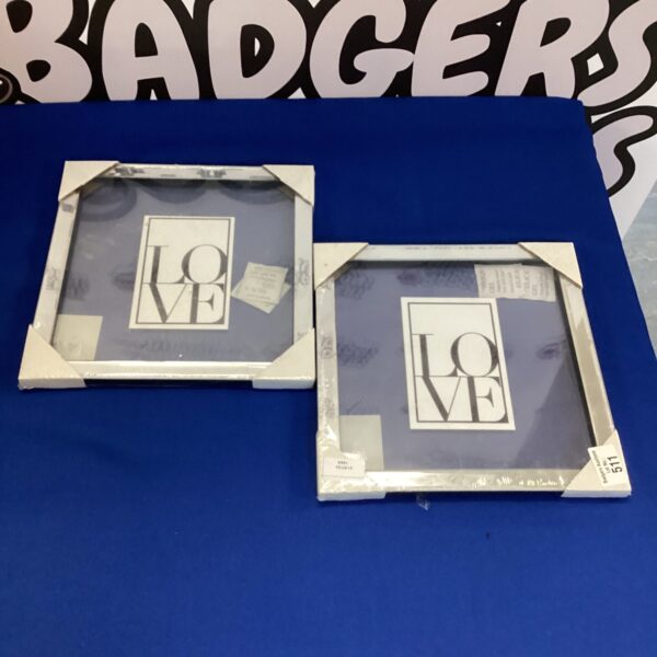Set of two mirror-framed picture frames for modern home decor.