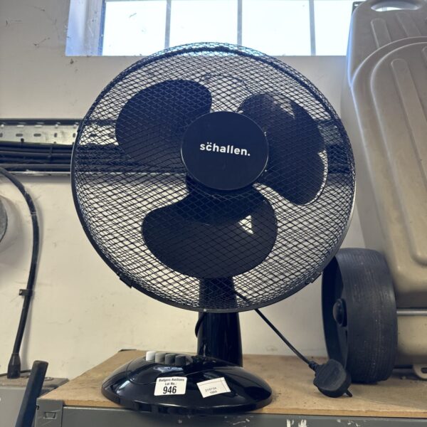 Vintage Schallen desk fan with metal cage.