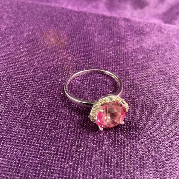 Silver ring with a pink and white stone cluster.