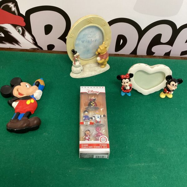 A selection of vintage Disney ornaments featuring classic characters.