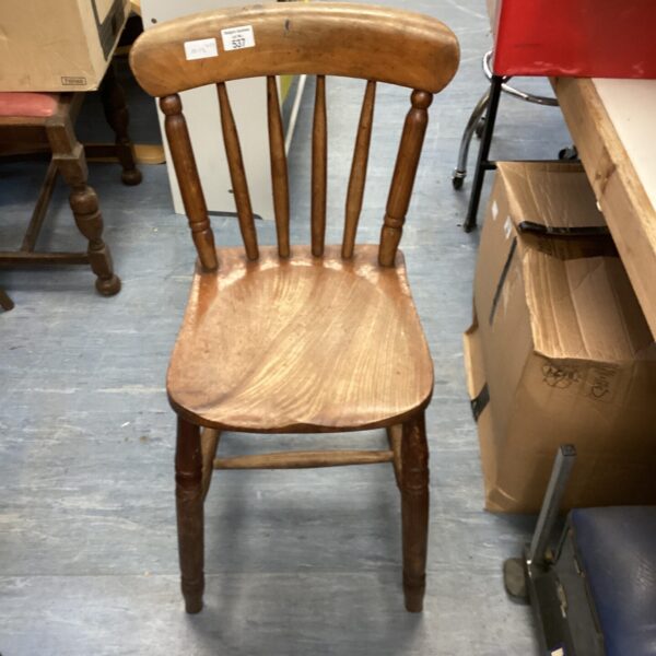 Vintage pine kitchen chair with three spindles and turned legs.