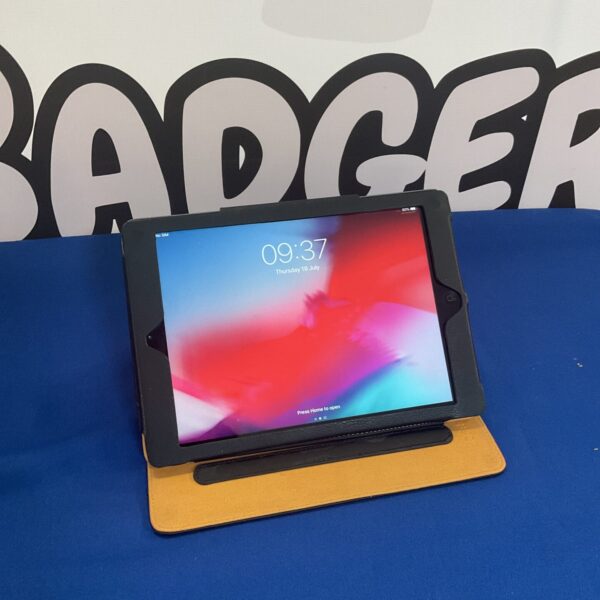 Apple iPad Air tablet displayed on a stand.