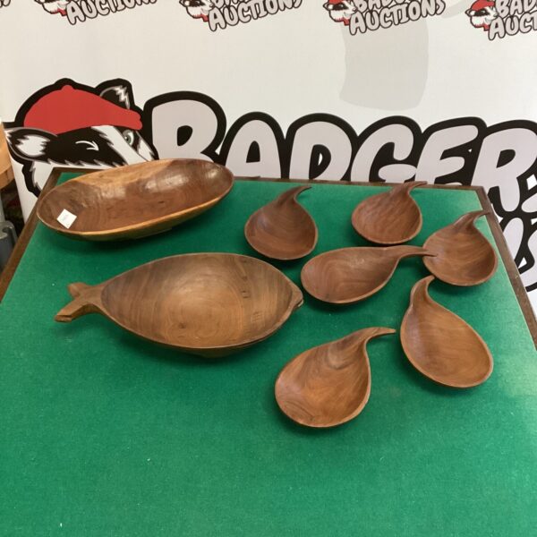 Selection of hand-carved wooden fruit bowls for rustic kitchen decor.