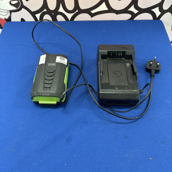 Gtech CLM battery and charger on a blue background.