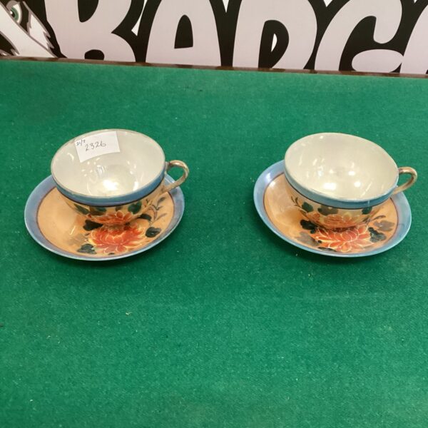 Vintage Japanese china cup and saucer with floral design.