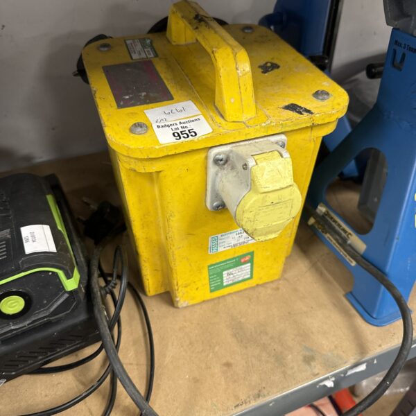 Yellow 110v power converter block for construction sites.