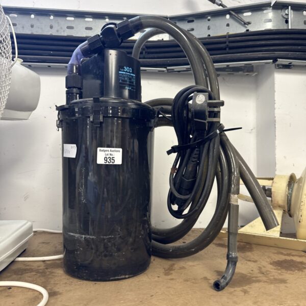 Front view of used Askoll pond pump with hose attached.