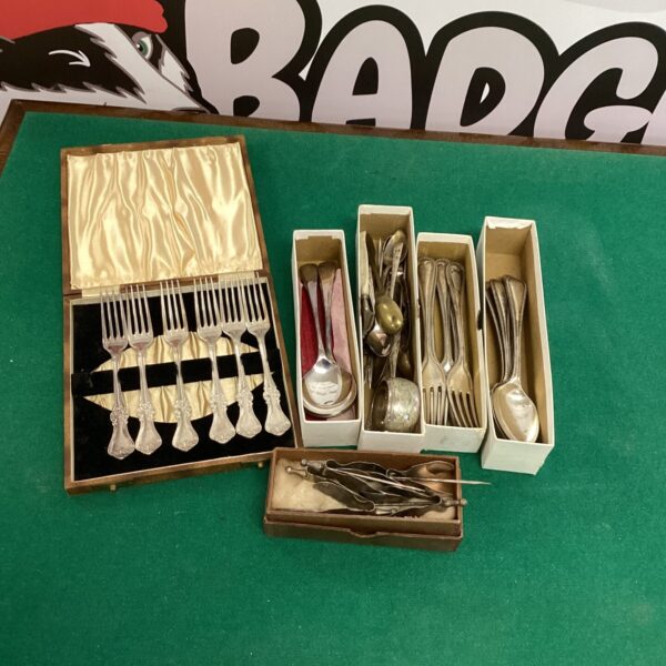 Vintage silverplate cutlery set displayed in a presentation case.