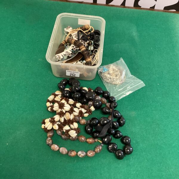 Assortment of vintage costume jewellery beaded necklaces in various colours.