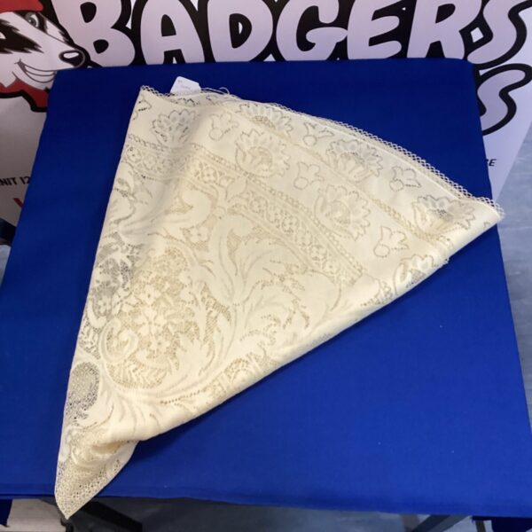 Delicate vintage Malters lace tablecloth with floral design.