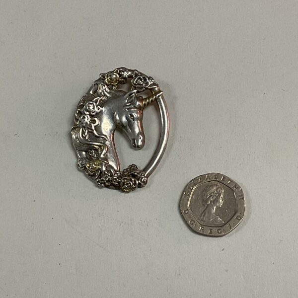 Hallmarked silver unicorn pendant, detailed fantasy jewellery.
