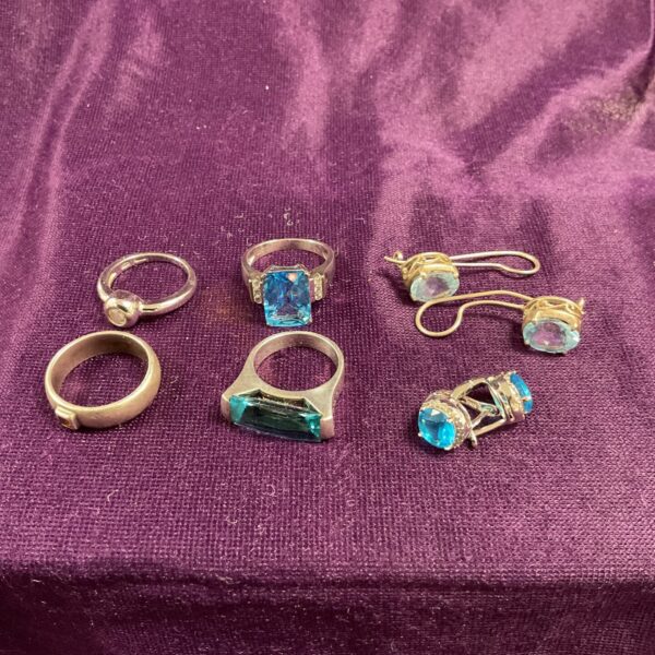 Vintage silver rings and earrings with blue stones.