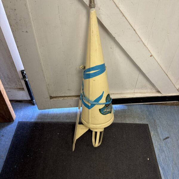 Vintage Minimax conical fire extinguisher mounted on a wall.