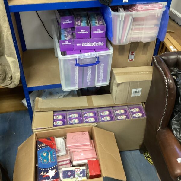 Large lot of occasion cards and gift wrapping paper for celebrations.