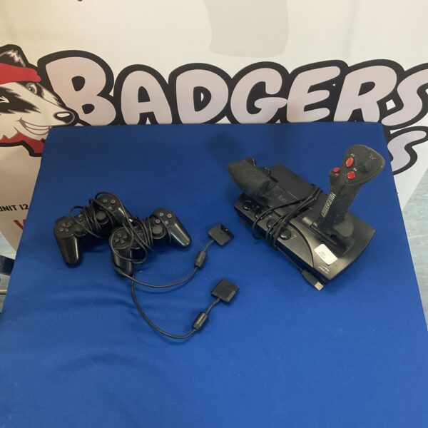 PS2 controllers and Speedlink Black Widow gamepad for retro gaming.