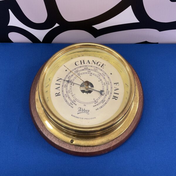 Antique brass Abbey precision barometer for weather forecasting.