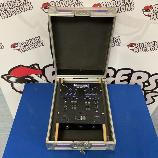 Vintage Numark DM1001X DJ mixer with multiple controls.