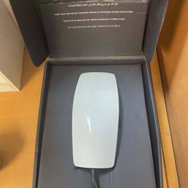 Tesla Wall Connector charger for electric vehicle home charging.