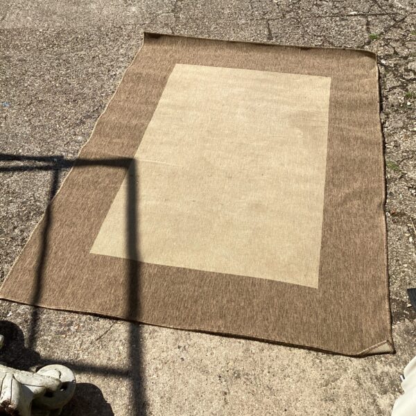 Cream woven rug measuring 8x4 feet, ideal for home decor.