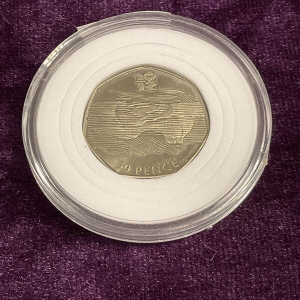 Rare 2011 50p coin with aquatic design and visible misprint.