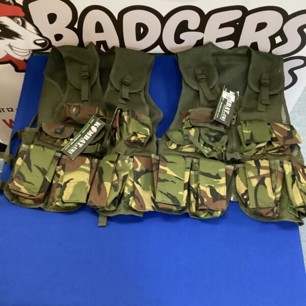 Two Kombat camo tactical vests with MOLLE webbing.