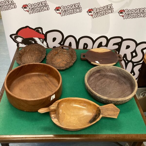 Selection of handcrafted wooden bowls for rustic kitchen decor.