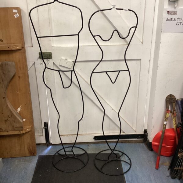 Vintage metal mannequin pair for shop display and fashion.