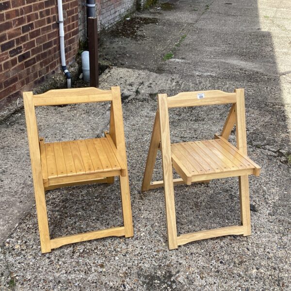 Pair of vintage pine folding chairs for garden or camping.