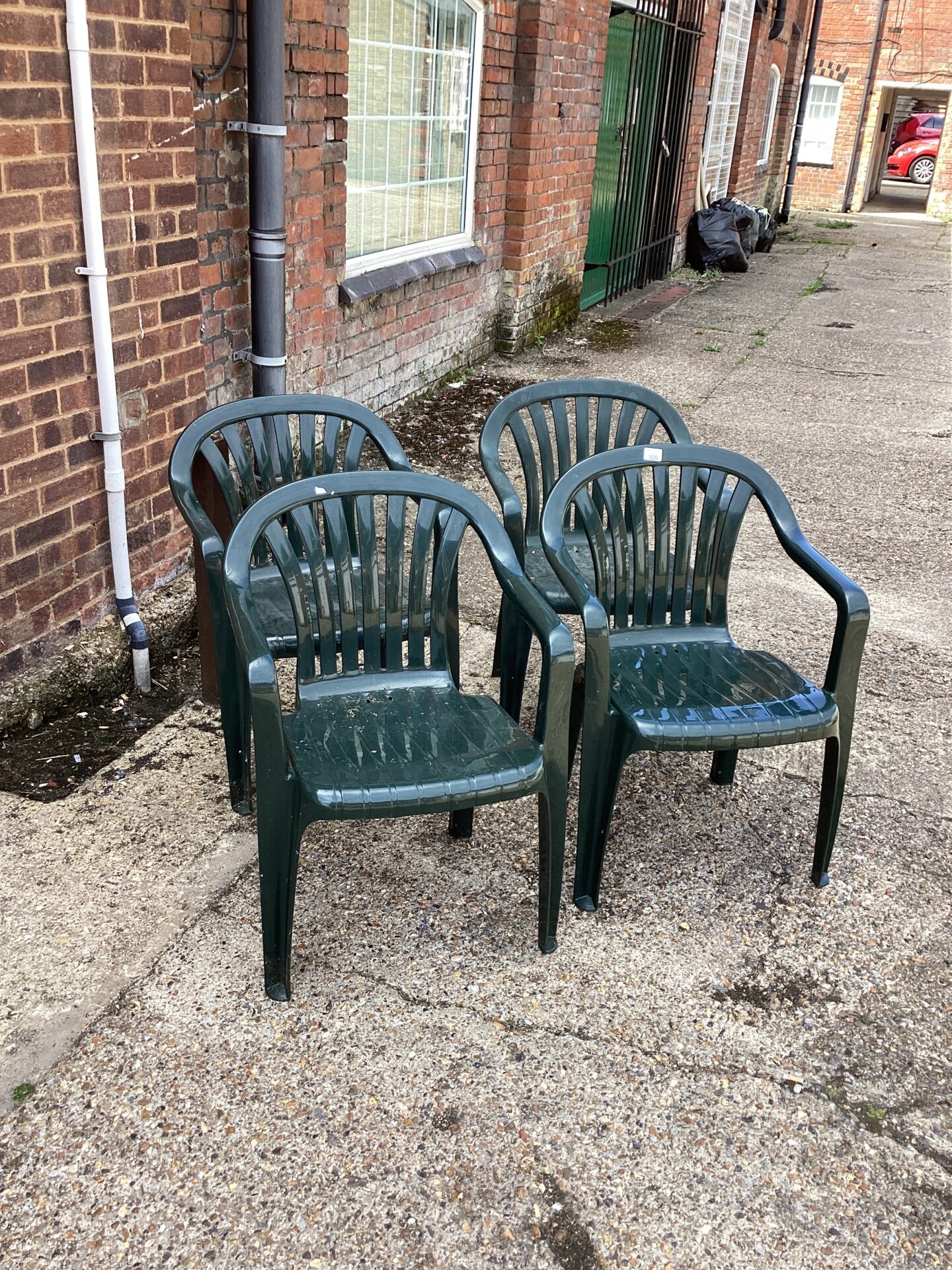 1039 Four Brown Plastic Garden Chairs