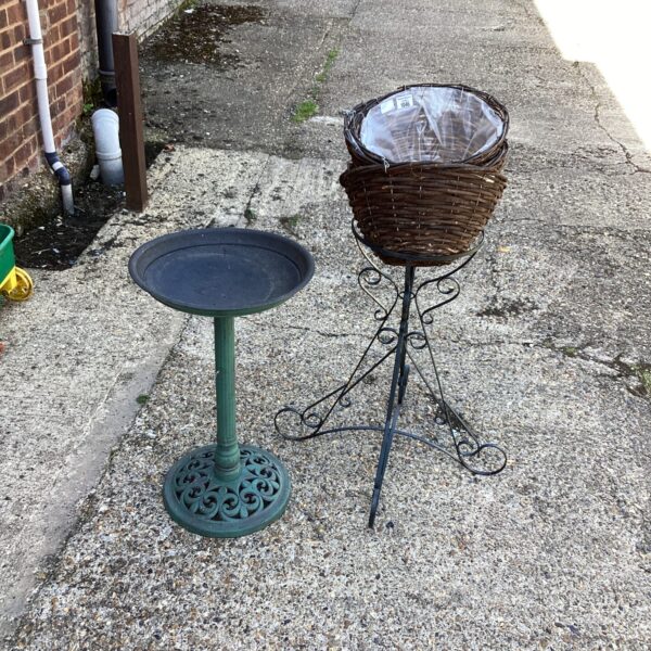 Vintage garden bird bath and flower stand for outdoor display.