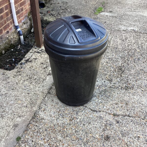 Large plastic dustbin for garden waste and refuse.