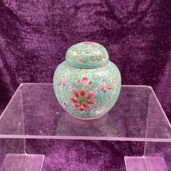 Vibrant Famille Vert ginger jar with floral designs.
