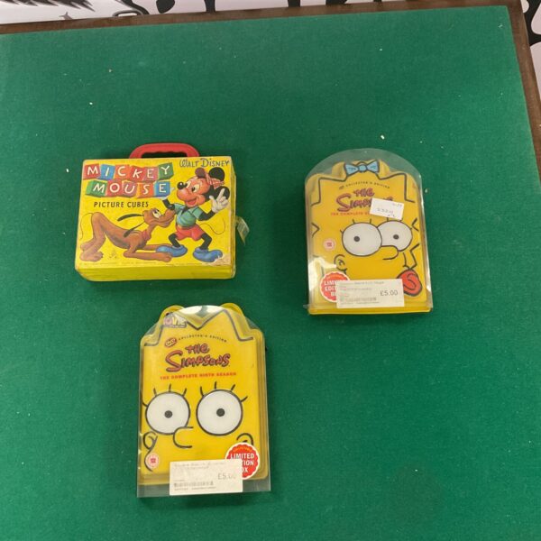 Vintage Disney Mickey Mouse picture cubes and Simpsons DVDs collectible lot.