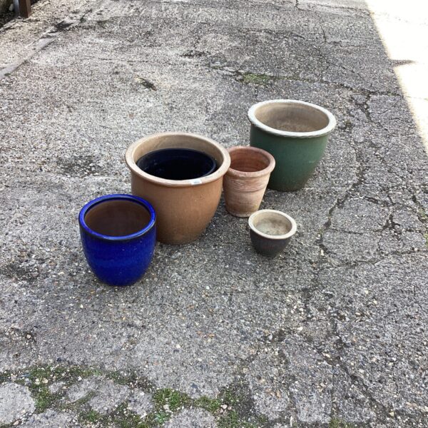 Selection of terracotta and ceramic garden planters for outdoor use.