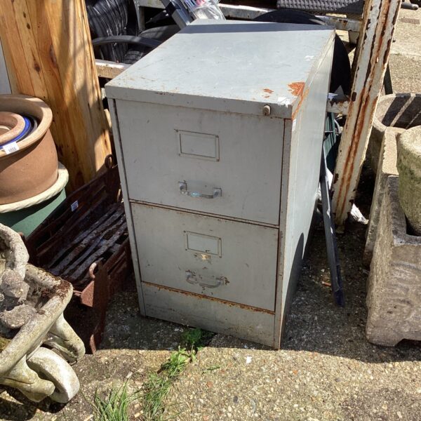 Vintage grey metal filing drawers for office storage.