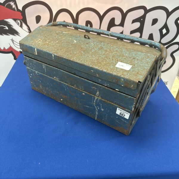 Vintage metal cantilever toolbox with patina and rust.