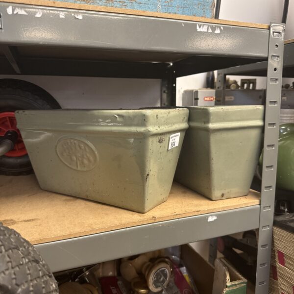 Two glazed terracotta planters for garden use.