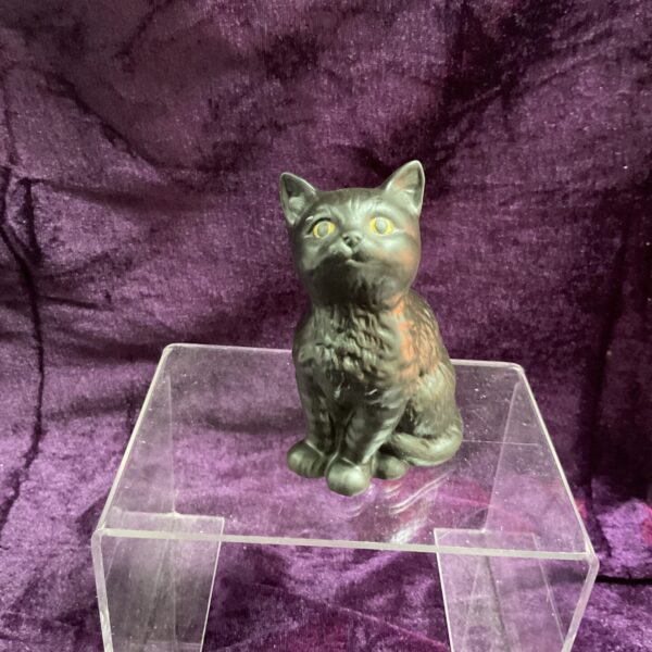 Vintage Beswick black cat figurine on a clear stand.