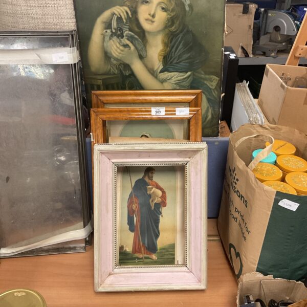 Vintage picture frames with a pastoral painting of a shepherdess.