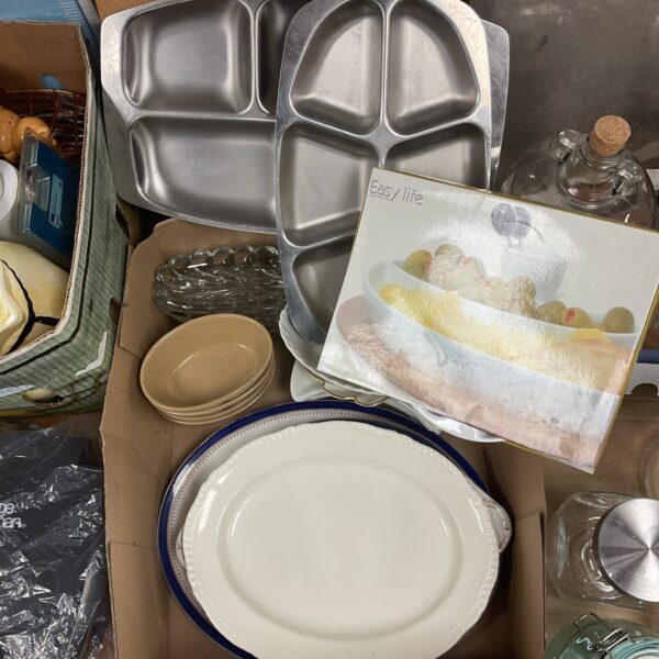 Assorted plastic serving dishes and trays in a mixed lot.