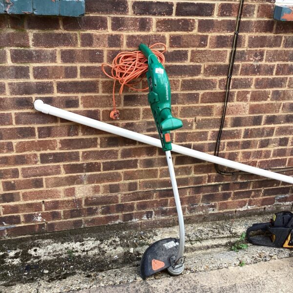 Black and Decker electric strimmer for garden maintenance and lawn edging.